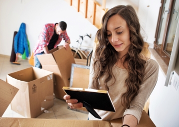 A family unpacking boxes